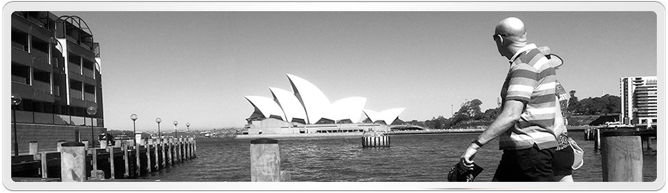 Photo of Sydney Opera House admired by passers by