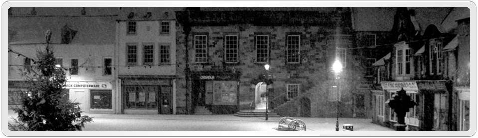 Both Andrew Hindmarsh & Eleanor Reed were born in Alnwick, Northumberland, England. This photo by Andy Armstrong shows the Alnwick marketplace on a snowy night in 2006.