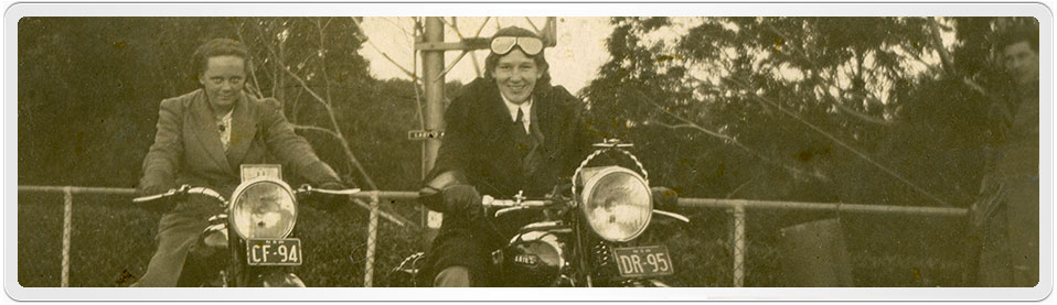 Dorothy Amelia Morris posing on Triumph Bike CF-24, Unknown Male sitting on Ariel Bike DR-95. Stanley Lloyd Hall, almost out of frame, can be seen on the far right of the picture.